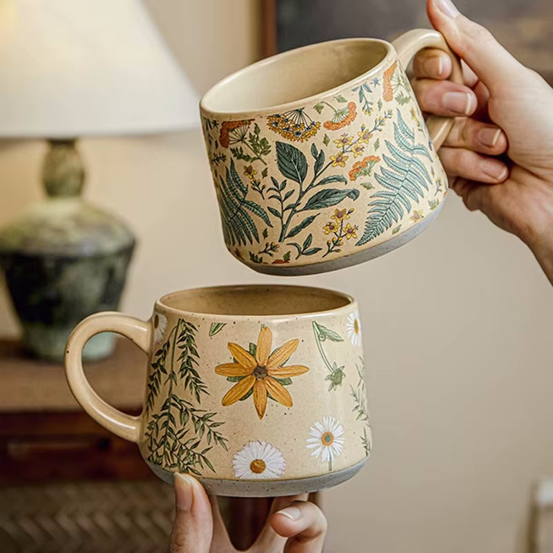 Plant Lover Holding Enchanting Botanicals Ceramic Mugs With Flower Patterns