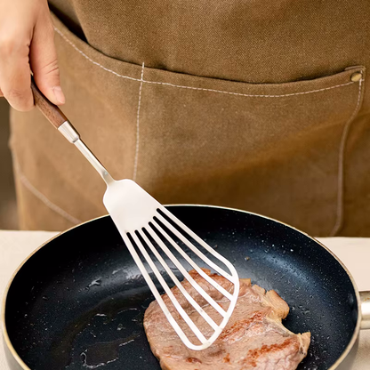 Home Chef Cooking Meat With Slotted Spatula Turner In Luxury Sleek Utensil Style