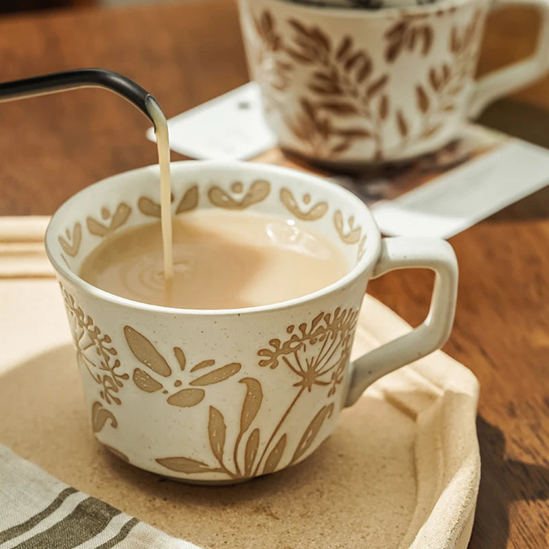 Pouring Hot Tea Into Organic Botanics Ceramic Tea Cup In Butterfly Garden Pattern