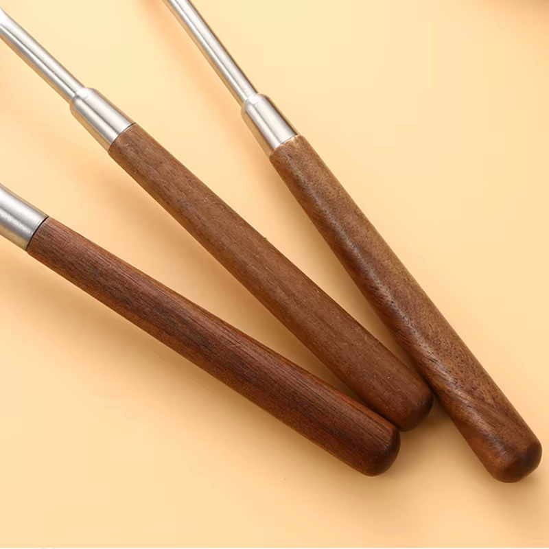 Stainless Steel Luxury Chef Sleek Metal And Wooden Handle Utensils Closeup On Walnut Wood Grains