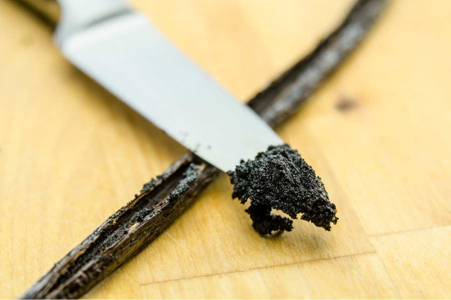 Close Up Of Vanilla Bean Pod And Inside Rich Vanilla Scapings