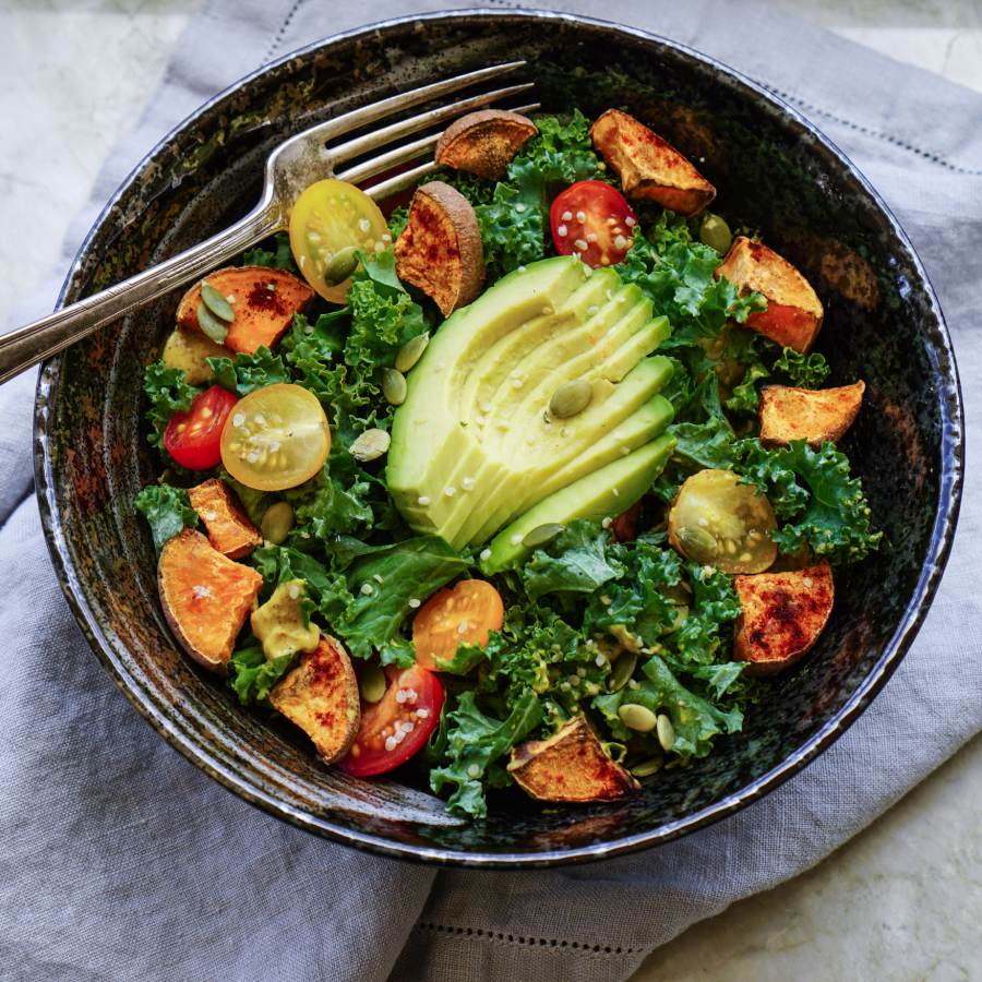 Kale Roasted Yams Sweet Potatoes And Avocado Salad With Tomatoes And Pumpkin Seeds Topped With Drizzle Of Organic Fair Trade Agave From Terra Powders