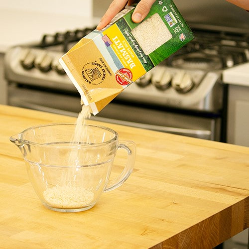 Pouring Non-GMO Basmati Rice From Ralston Family Farms Easy Pour Rice Carton