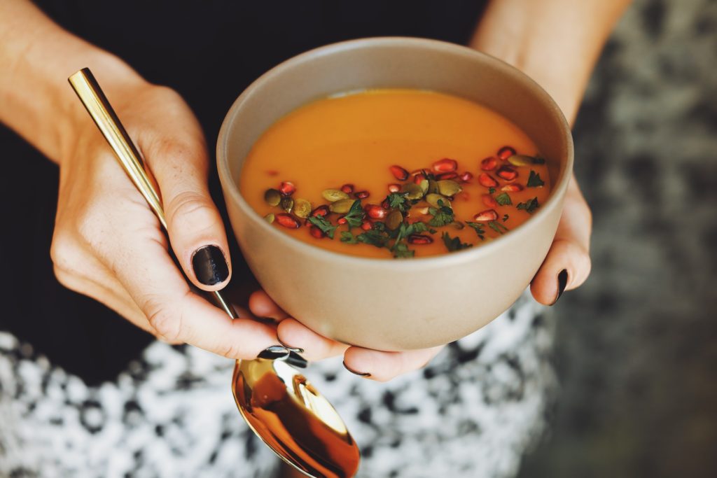 Pumpkin Apple Soup Autumn Recipe Using Madhava Creamed Honey Garnished With Pumpkin Seeds And Pomegranate Arils