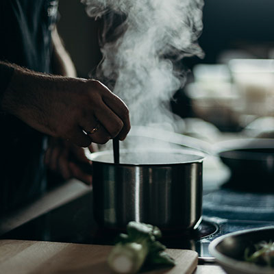 Stirring A Simmering Cooking Pot Of Ralston Aromatic Rice