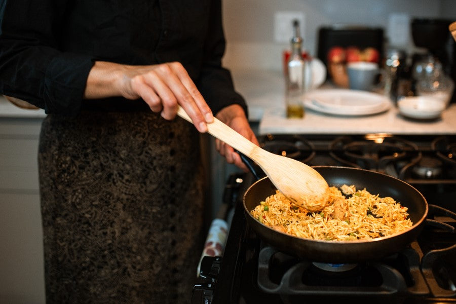 Woman Cooking Organic Brown Jasmine Rice From Terra Powders Clean Food Market